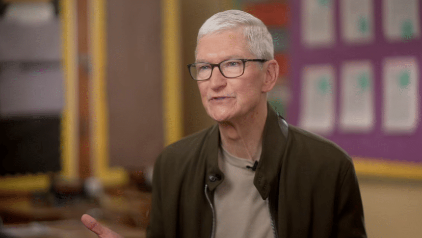Gray-haired man wearing glasses during an interview.