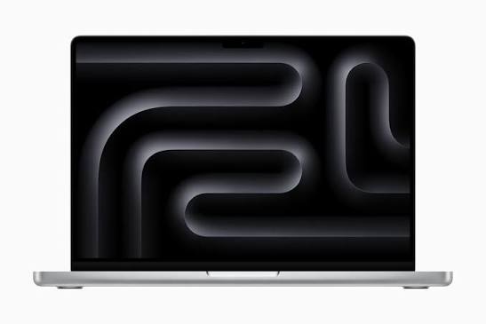 Silver MacBook Pro with a dark abstract wallpaper displayed on its screen.
