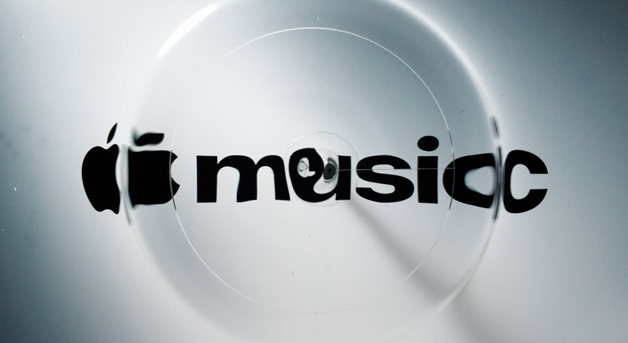 Apple Music logo distorted by circular liquid ripples.