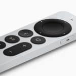 Silver Apple TV remote with black control buttons.
