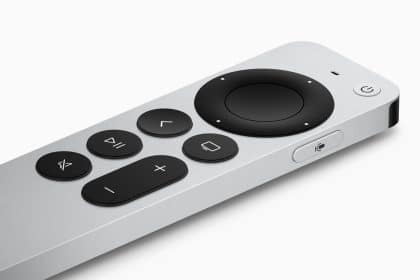Silver Apple TV remote with black control buttons.