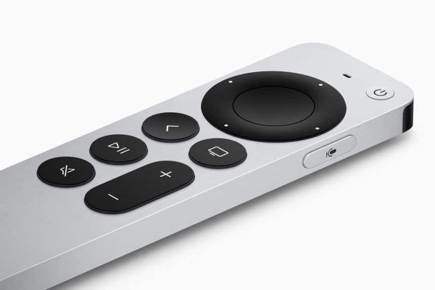 Silver Apple TV remote with black control buttons.
