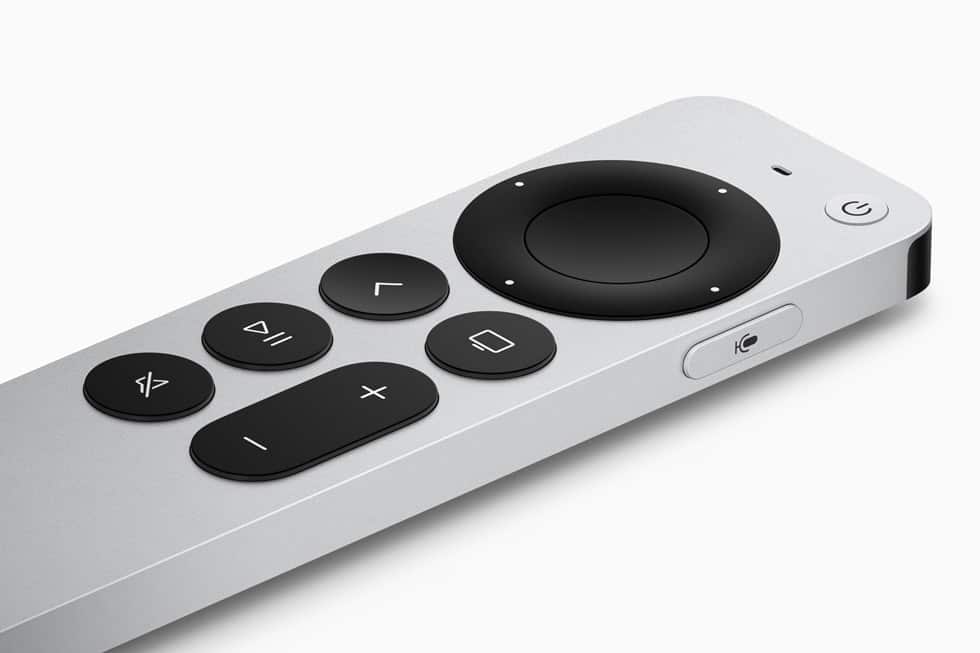 Silver Apple TV remote with black control buttons.