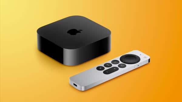 Black Apple TV 4K streaming device with a silver Siri Remote on a yellow background.