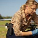 Detective investigating a crime scene in the Australian drama Dustfall.