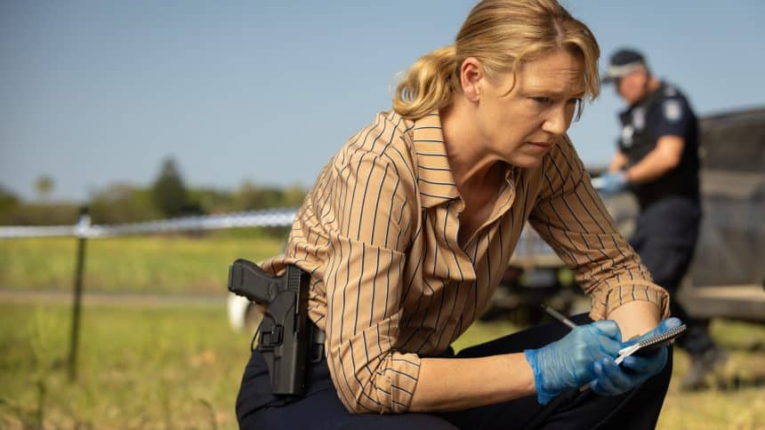 Detective investigating a crime scene in the Australian drama Dustfall.