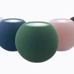 Apple HomePod mini speakers displayed in white, blue, green, pink, and black.