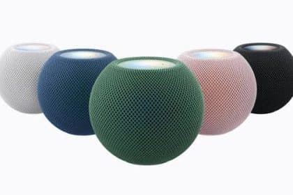 Apple HomePod mini speakers displayed in white, blue, green, pink, and black.