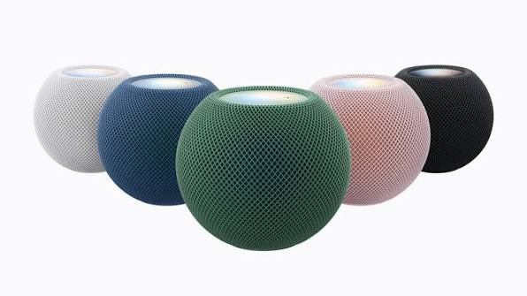 Apple HomePod mini speakers displayed in white, blue, green, pink, and black.