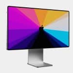 Apple iMac with a colourful display and silver stand.