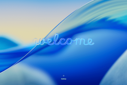 macOS Tahoe welcome screen with a blue wave background.